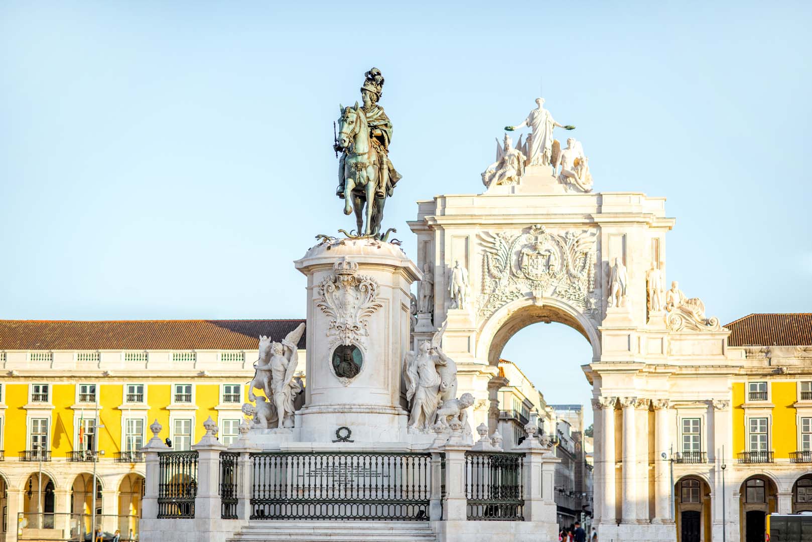 Morning view on the Commerce square with statue fo king Joseph and Triumphal arch in Lisbon city, Portugal