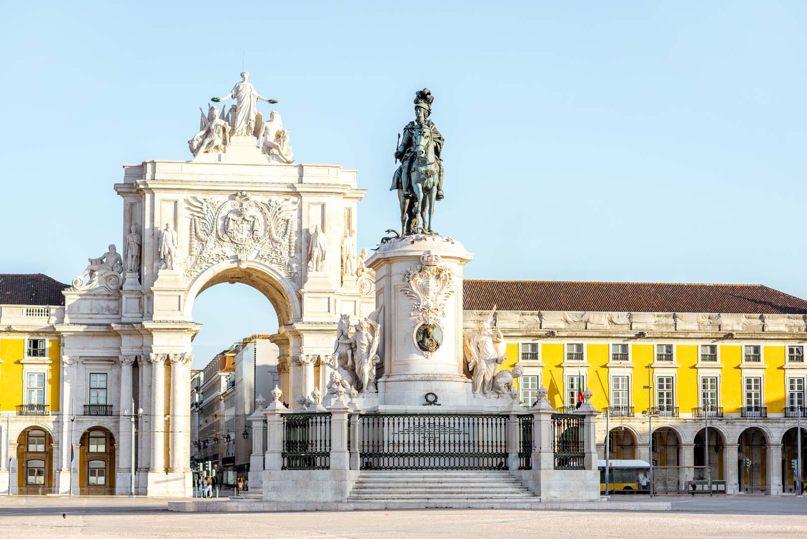 Morning view on the Commerce square with statue fo king Joseph and Triumphal arch in Lisbon city, Portugal
