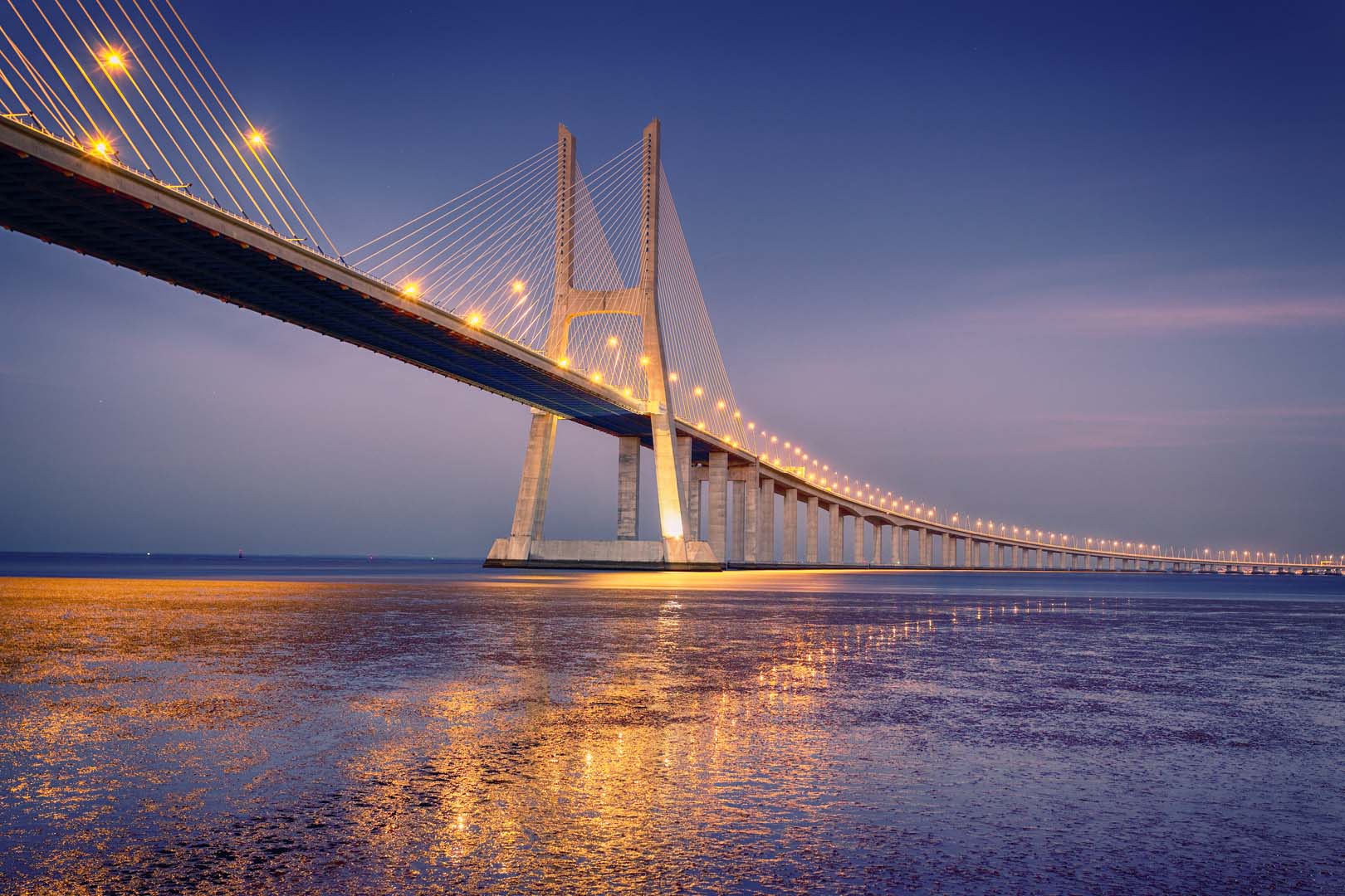 sunrise on Vasco da Gama bridge in Lisbon, Portugal